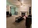 Inviting living room with fireplace, ceiling fan, and comfortable seating area at 4382 Valley Regal Way, North Las Vegas, NV 89032
