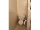 This clean bathroom features a standard white toilet with a matching paper holder at 4382 Valley Regal Way, North Las Vegas, NV 89032