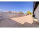 Spacious, private backyard with a large block wall offering seclusion and desert landscaping at 4454 Harmony Ct, Las Vegas, NV 89121