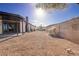 Backyard area featuring stone landscaping and exterior of the home with covered patio at 4454 Harmony Ct, Las Vegas, NV 89121