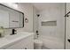 Bathroom featuring a marble-tiled shower, tub, and modern vanity at 4454 Harmony Ct, Las Vegas, NV 89121