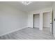 Bedroom with wood-look flooring, closet, and open doorway at 4454 Harmony Ct, Las Vegas, NV 89121