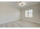 Bedroom with wood-look flooring and window with plantation shutters at 4454 Harmony Ct, Las Vegas, NV 89121
