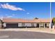 Charming single-story home featuring a tile roof, two-car garage, and well-maintained landscaping on a sunny day at 4454 Harmony Ct, Las Vegas, NV 89121