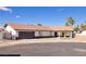 Charming single-story home featuring a tile roof, two-car garage, and well-maintained landscaping on a sunny day at 4454 Harmony Ct, Las Vegas, NV 89121