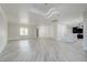 Bright living room with recessed lighting, light wood floors, open to kitchen, creating a welcoming living space at 4454 Harmony Ct, Las Vegas, NV 89121