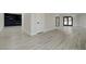 Bright living room featuring light wood floors, neutral walls, recessed lighting, and stylish design elements at 4454 Harmony Ct, Las Vegas, NV 89121