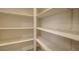 Walk-in pantry offers ample storage with multiple rows of white shelving, providing organization and convenience at 4454 Harmony Ct, Las Vegas, NV 89121