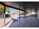 Relaxing outdoor patio with view of backyard, lush green trees and inviting sparkling pool at 4454 Harmony Ct, Las Vegas, NV 89121