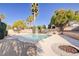 Private backyard pool featuring desert landscaping, mature trees and a relaxing oasis at 4454 Harmony Ct, Las Vegas, NV 89121
