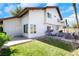 Backyard view of the home with green lawn, patio, and outdoor seating at 4680 Freshwater Dr, Las Vegas, NV 89103