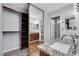 Bathroom featuring double sinks, granite counters, and a walk-in closet at 4680 Freshwater Dr, Las Vegas, NV 89103