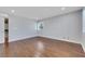 Bedroom featuring hardwood floors, light gray walls, shutters and closet at 4680 Freshwater Dr, Las Vegas, NV 89103