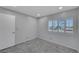 Cozy bedroom with updated carpet, shuttered window, and neutral paint at 4680 Freshwater Dr, Las Vegas, NV 89103