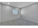 Bedroom with neutral carpet, shuttered window, and recessed lighting at 4680 Freshwater Dr, Las Vegas, NV 89103