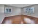 Bedroom featuring hardwood floors, light gray walls, and shutters at 4680 Freshwater Dr, Las Vegas, NV 89103