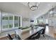 Bright dining room featuring a modern chandelier and expansive windows at 4680 Freshwater Dr, Las Vegas, NV 89103