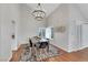 Dining room features hardwood floors, vaulted ceilings, and modern decor at 4680 Freshwater Dr, Las Vegas, NV 89103