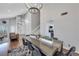 Dining room with modern decor, hardwood floors, and open layout to living room at 4680 Freshwater Dr, Las Vegas, NV 89103