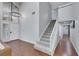 Grand entryway featuring soaring ceilings, hardwood floors, staircase, and a stylish chandelier at 4680 Freshwater Dr, Las Vegas, NV 89103