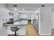 Bright kitchen featuring granite counters, stainless steel appliances and white cabinetry at 4680 Freshwater Dr, Las Vegas, NV 89103