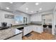 Bright kitchen with granite countertops, stainless steel appliances, and white cabinetry at 4680 Freshwater Dr, Las Vegas, NV 89103