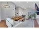 Spacious living room with vaulted ceilings, hardwood floors, and a cozy seating area at 4680 Freshwater Dr, Las Vegas, NV 89103