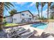 Backyard pool with lounge chairs and privacy fence is great for relaxing at 4680 Freshwater Dr, Las Vegas, NV 89103