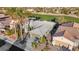 Aerial view of a well-maintained home with mature trees, landscaping, and a golf course in the background at 4718 Atlantico St, Las Vegas, NV 89135