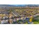 Expansive aerial view of a residential community with a golf course, showcasing homes and mountain views at 4718 Atlantico St, Las Vegas, NV 89135