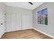 This bedroom features a spacious closet, wood floors, and a large window with a view at 4718 Atlantico St, Las Vegas, NV 89135