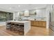 Modern kitchen with a large island, stainless steel appliances, and light wood cabinets at 4718 Atlantico St, Las Vegas, NV 89135