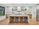 Bright kitchen features modern appliances, a large island with seating, and stylish countertops at 4718 Atlantico St, Las Vegas, NV 89135