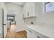 This bright laundry room features shaker cabinets, countertops, and a sink at 4718 Atlantico St, Las Vegas, NV 89135