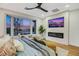 Inviting main bedroom with ceiling fan, fireplace, TV, and a lovely large window to enjoy the outdoor views at 4718 Atlantico St, Las Vegas, NV 89135