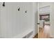This mudroom features white wainscotting, coat hooks, and bench seating with storage at 4718 Atlantico St, Las Vegas, NV 89135
