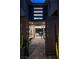 Welcoming entryway with stone pathway and a glimpse of the stylish interior and outdoor pool at 5 Moonfire Dr, Las Vegas, NV 89135