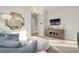 Cozy living room with a modern chandelier and stylish furniture, creating a comfortable and inviting space at 5 Moonfire Dr, Las Vegas, NV 89135