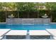 Beautiful pool featuring elegant water features, integrated lounge chairs, and lush landscaping for serene relaxation at 5 Moonfire Dr, Las Vegas, NV 89135