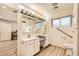 Bright bathroom features double vanity, ample lighting, wood-look flooring and built-in storage at 517 7Th St, Boulder City, NV 89005