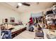 Functional bedroom with hardwood floors, ceiling fan, natural light, and storage at 517 7Th St, Boulder City, NV 89005