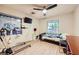 Bedroom with two windows for natural light, ceiling fan, light wood floors and medical equipment at 517 7Th St, Boulder City, NV 89005