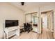 Bedroom with light wood floors, a closet with mirror doors and access to an attached bathroom at 517 7Th St, Boulder City, NV 89005