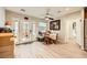 Cozy breakfast nook features a ceiling fan, table, and chairs with a backyard view from the French doors at 517 7Th St, Boulder City, NV 89005