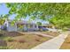 Attractive single-story home with a rock garden and mature landscaping at 517 7Th St, Boulder City, NV 89005
