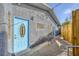 Exterior shows blue doors, textured facade, and compact outdoor space at 517 7Th St, Boulder City, NV 89005