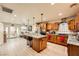 Well-lit kitchen boasts granite island with bar seating, stainless appliances, and hardwood floors at 517 7Th St, Boulder City, NV 89005