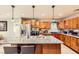 Beautiful kitchen with stainless steel appliances, a granite island with seating, and hardwood floors at 517 7Th St, Boulder City, NV 89005