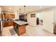 Modern kitchen with stainless appliances, hardwood floors, granite island, and access to the laundry room at 517 7Th St, Boulder City, NV 89005
