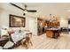 Open concept kitchen with stainless steel appliances, granite countertops, island, and adjacent breakfast nook at 517 7Th St, Boulder City, NV 89005